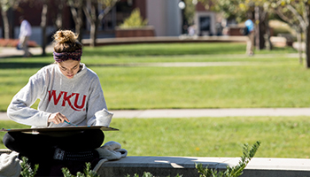 student studying outside