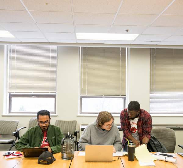 Three Western Kentucky University Mathematics students work on a research project.