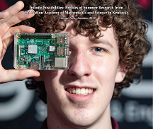 male student looking at computer processing chip