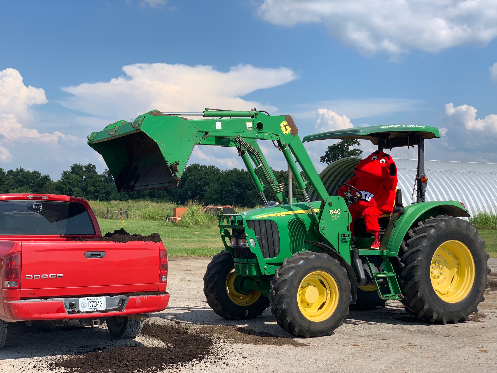 Big Red drives Mulch Tractor Big Red drives Mulch Tractor