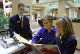 Food service managers reviewing menu restaurant mangers looking at menu