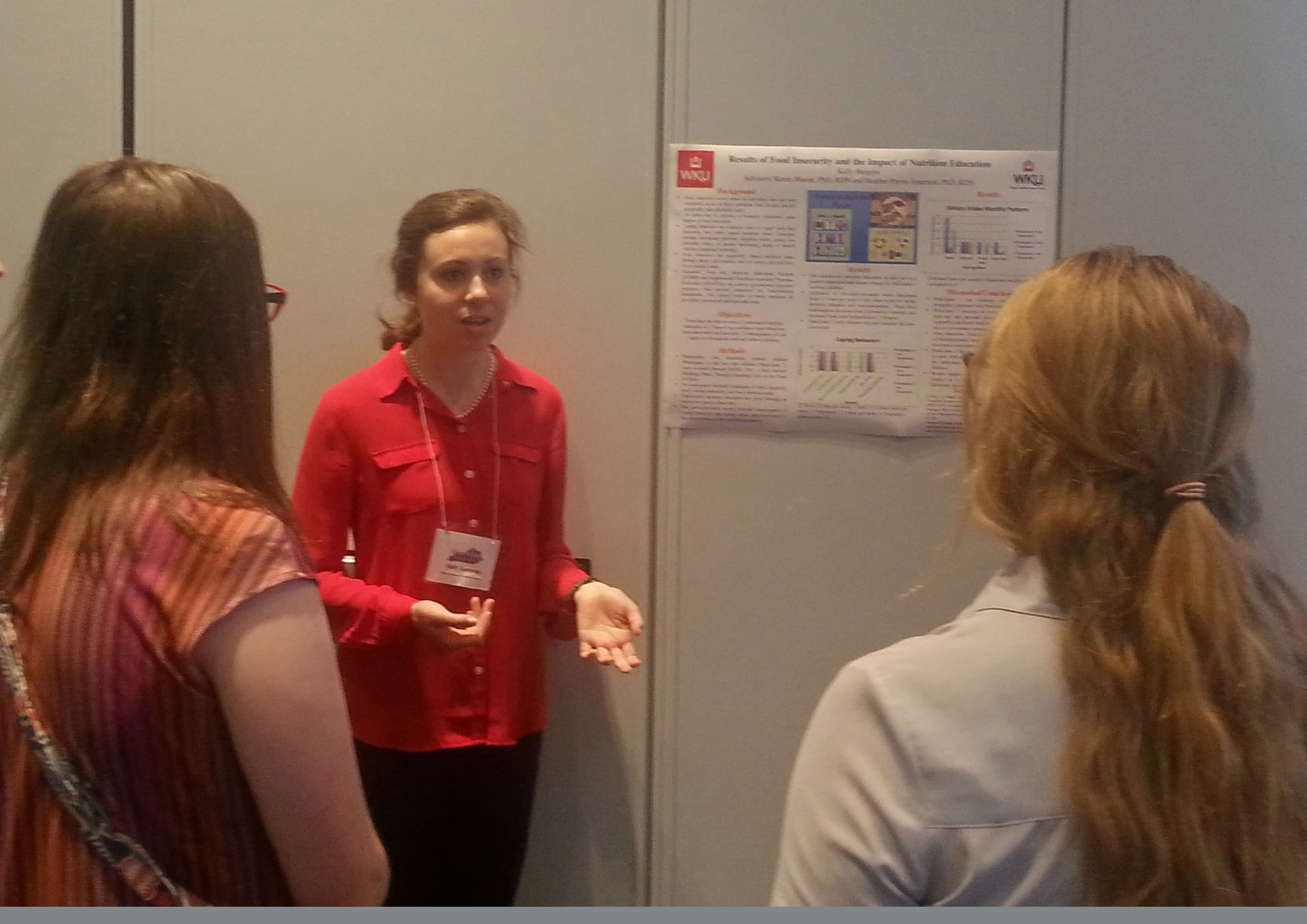 Kelly Burgess presenting poster