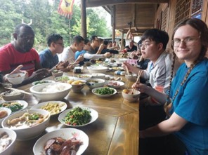 Evie Dukes enjoys a meal with colleagues at a Miao Nationality village in Wulong, Chongqing. CHL China Trip
