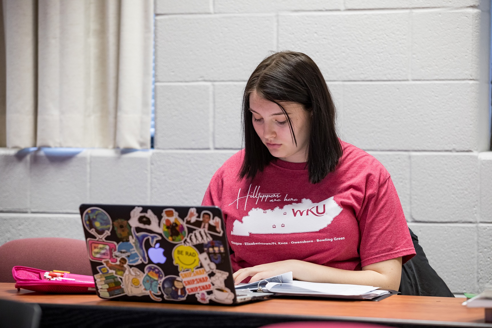 Student working on a laptop in class
