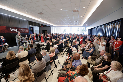 Guests listening to President Caboni at Chandler Hall dedication and ribbon cutting