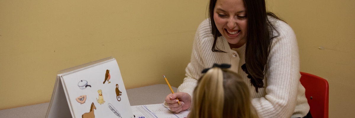 SLP working with student