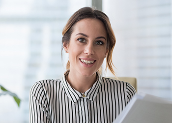 Headshot of a person smiling.