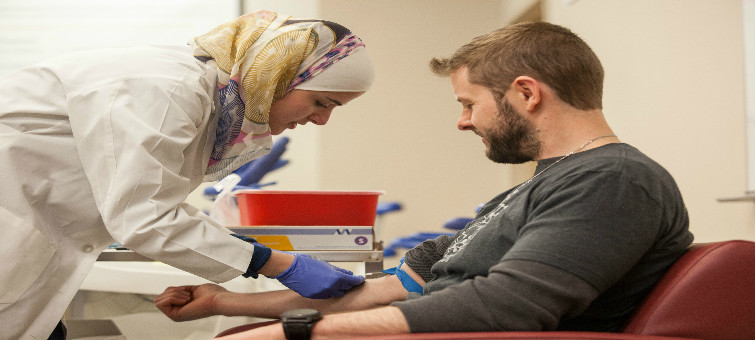 Nuha blood draw of Dustin