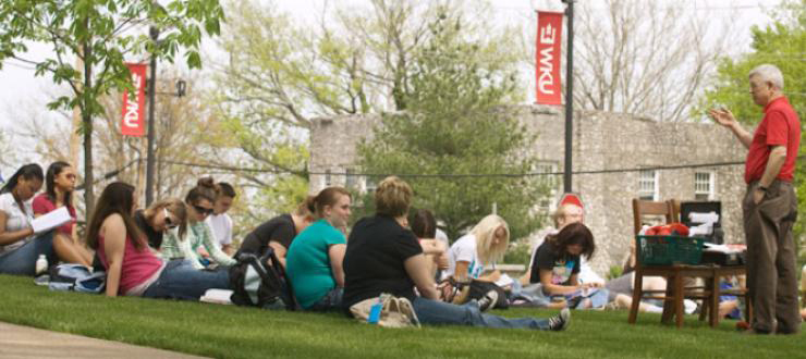 A WKU faculty member teaching a class outside