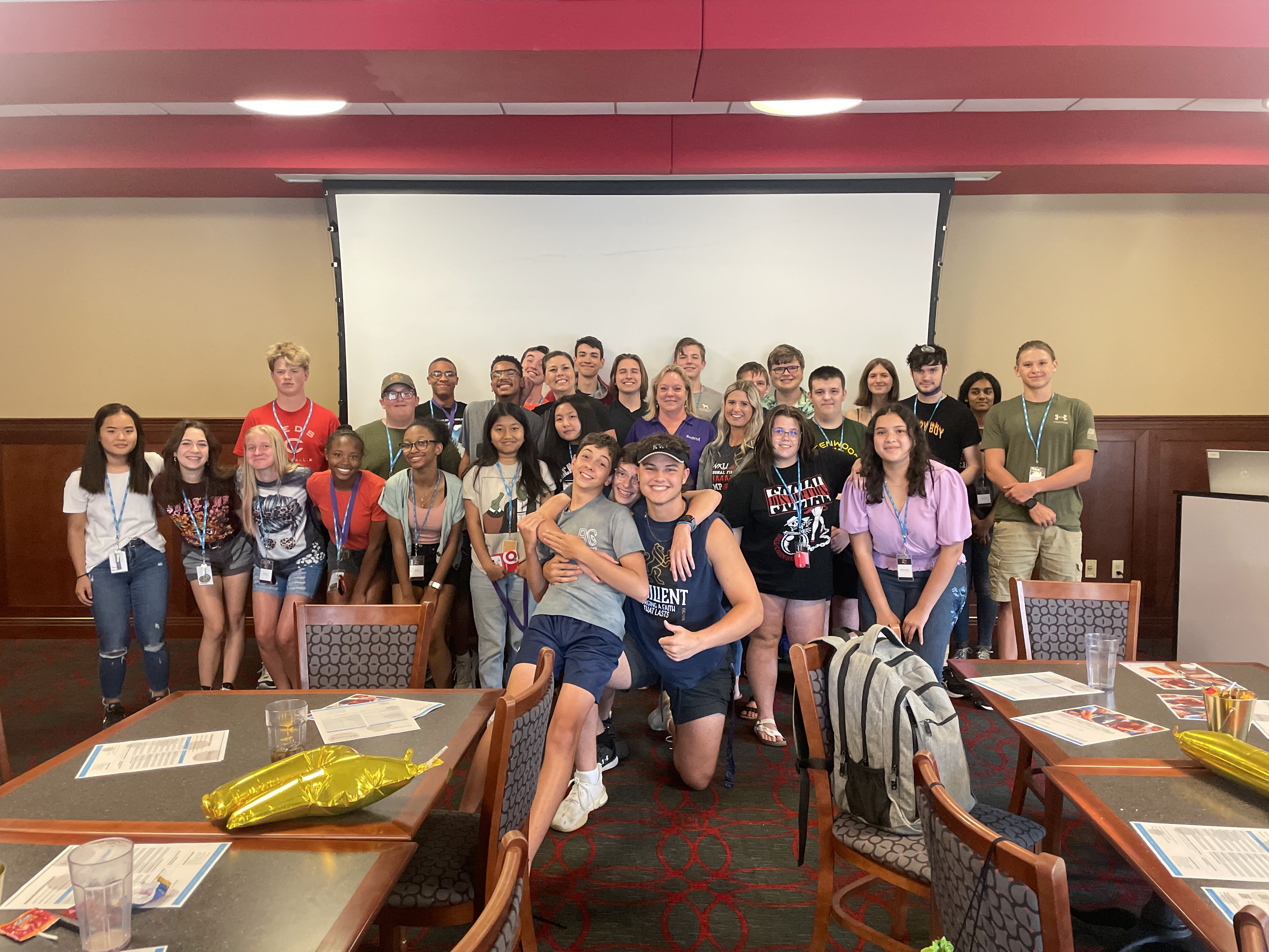 A group of students hang out in the rec room during camp.