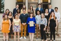 Rep. Patti Minter w/ some team members at the WKU Fall Tournament, marking her authorship of a citation recognizing the team months earlier