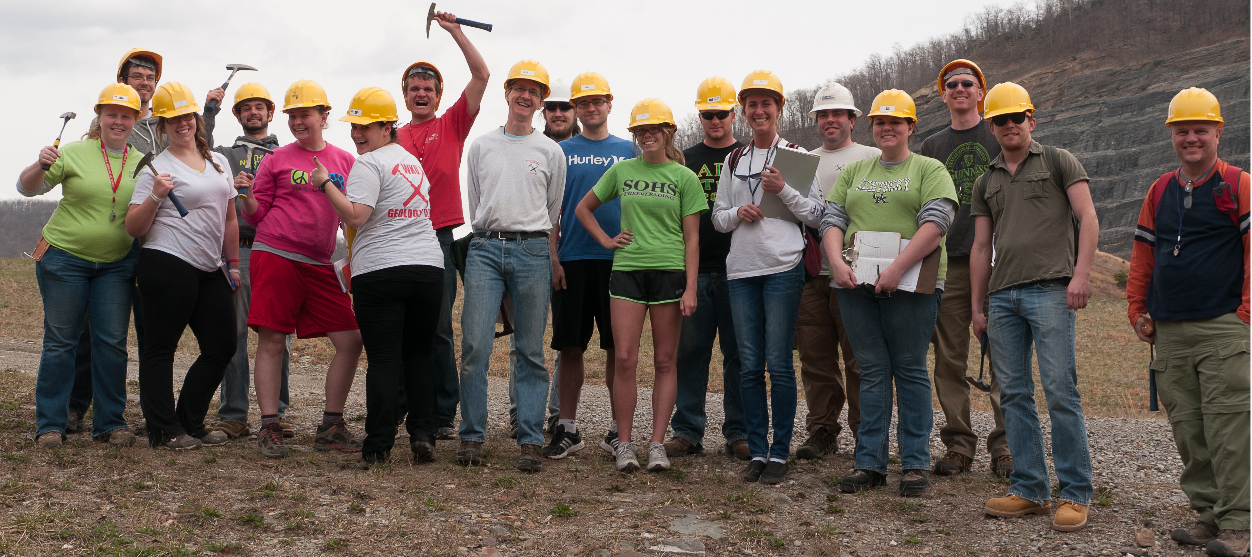 Students with rocks and stream