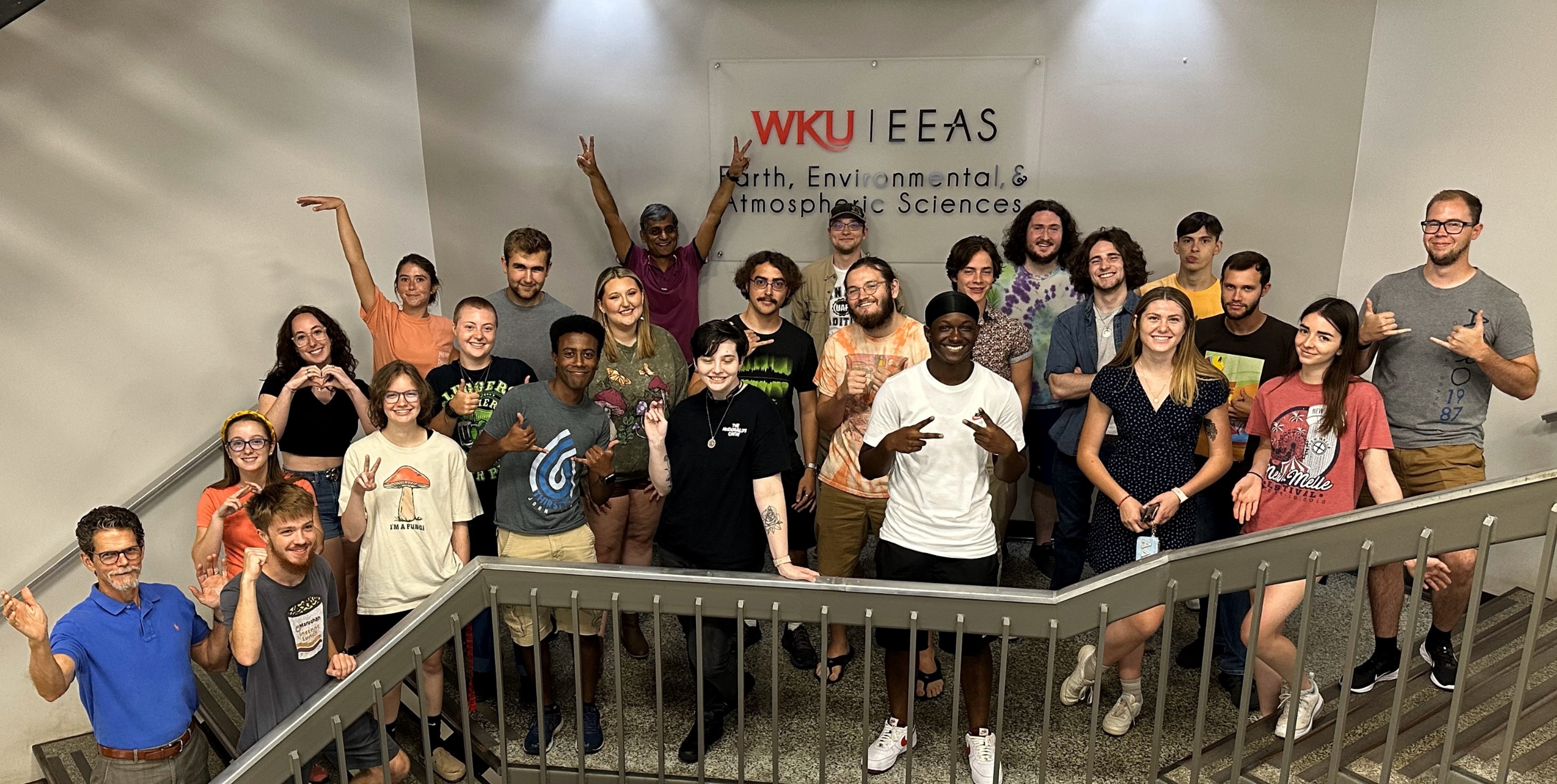 Students with rocks and stream