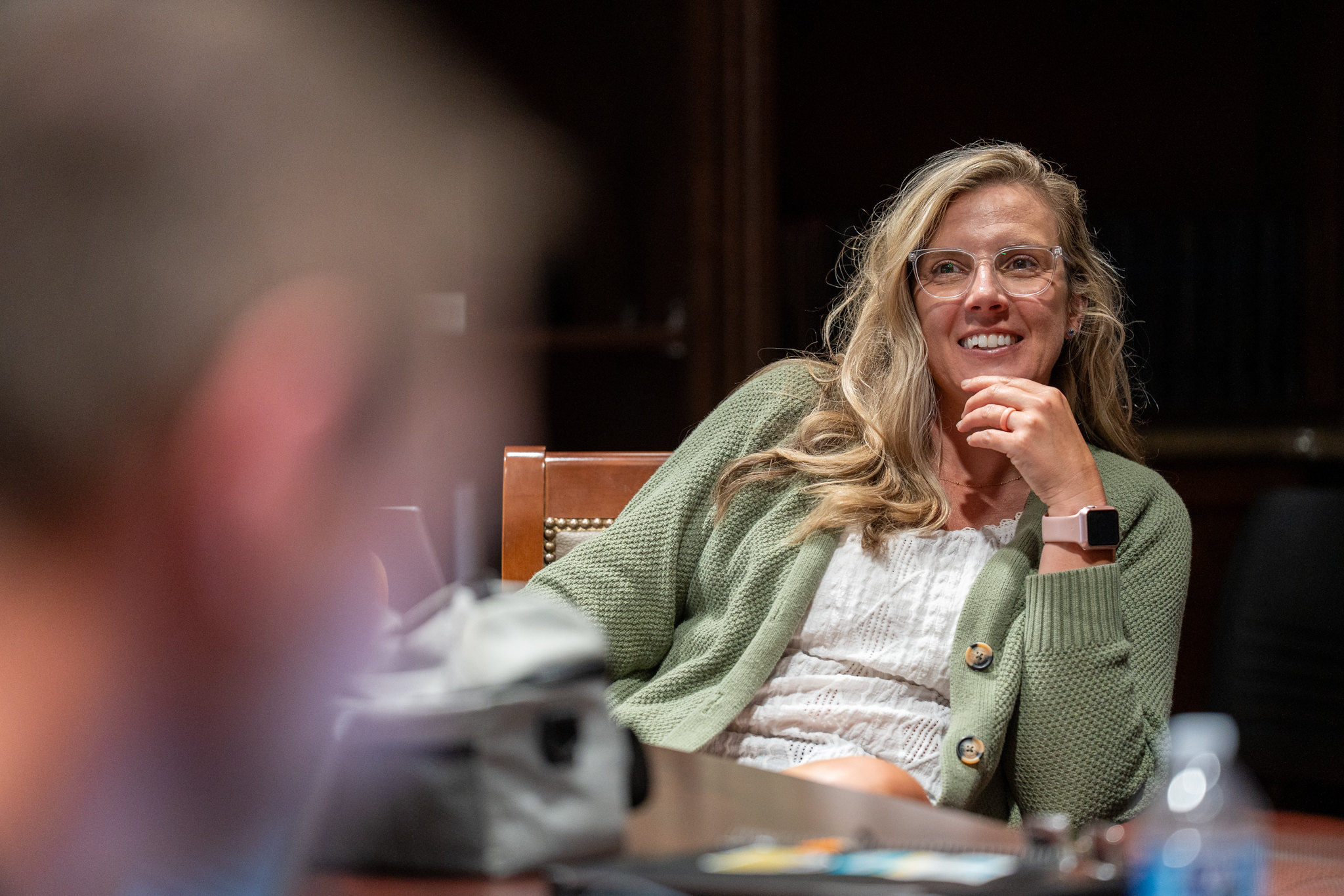 one woman smiling at the camera