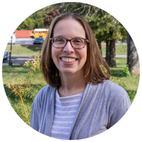 woman with glasses and striped shirt