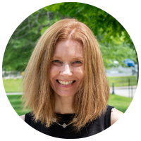 image of woman with red hair and black top