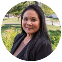 woman with long dark hair and a black top