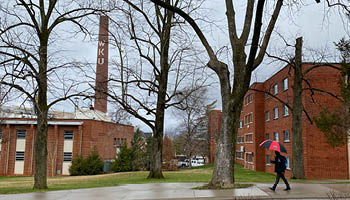 Student walking in the rain