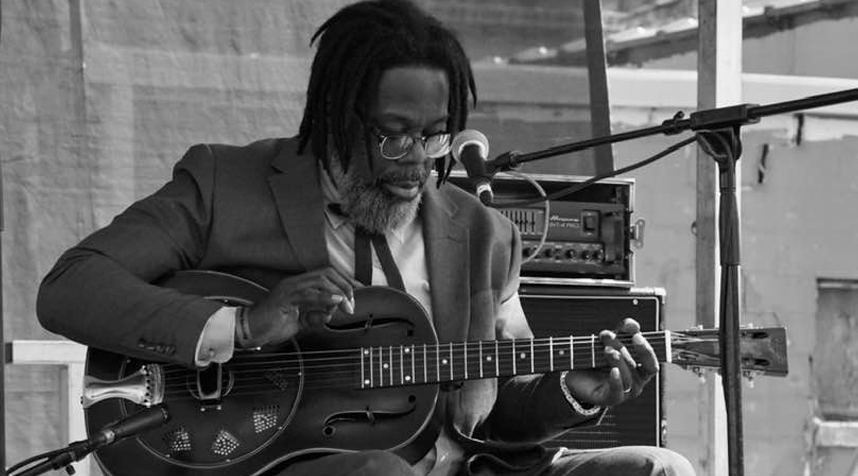 Lamont playing the blues on stage. Black and white photo.