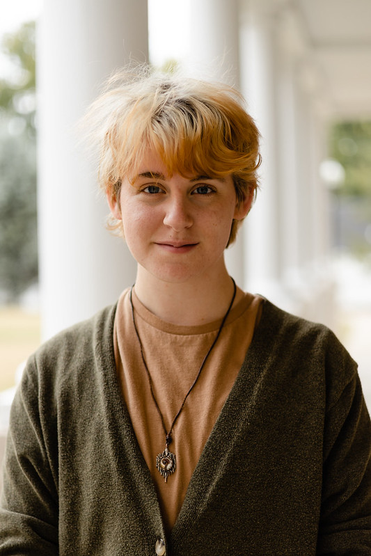 Blond young college student smiling at camera