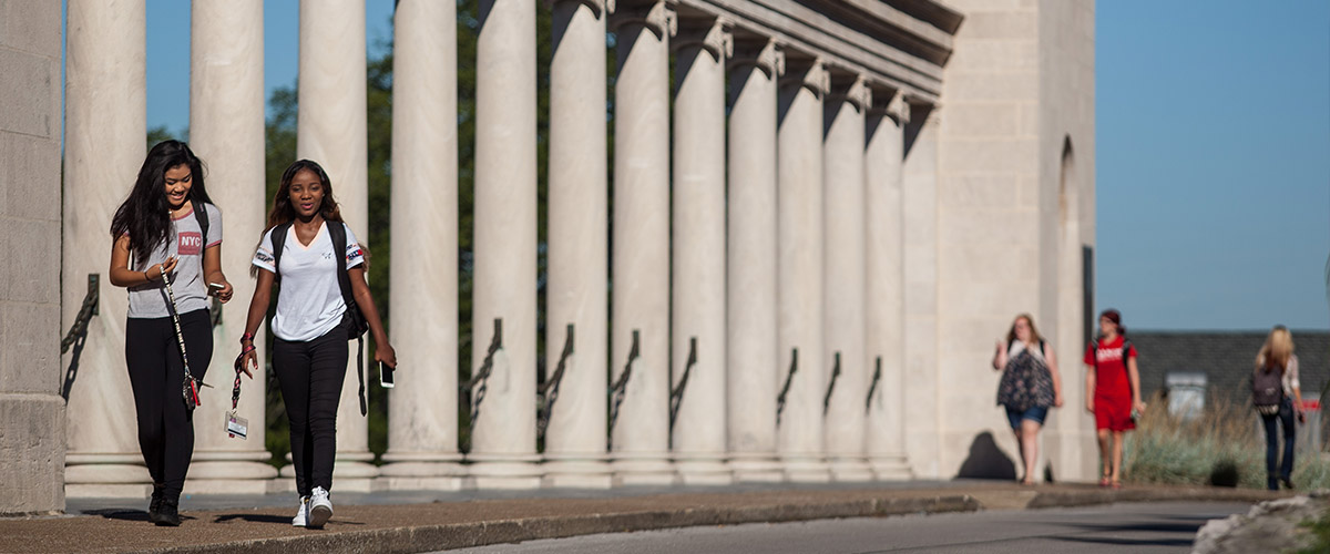 Students walking by Colonnade