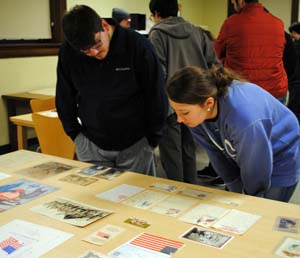 American Revolution History class viewing artifacts