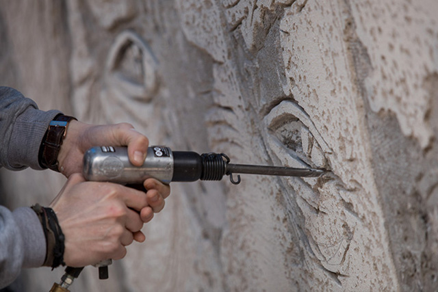 drilling into wall mural