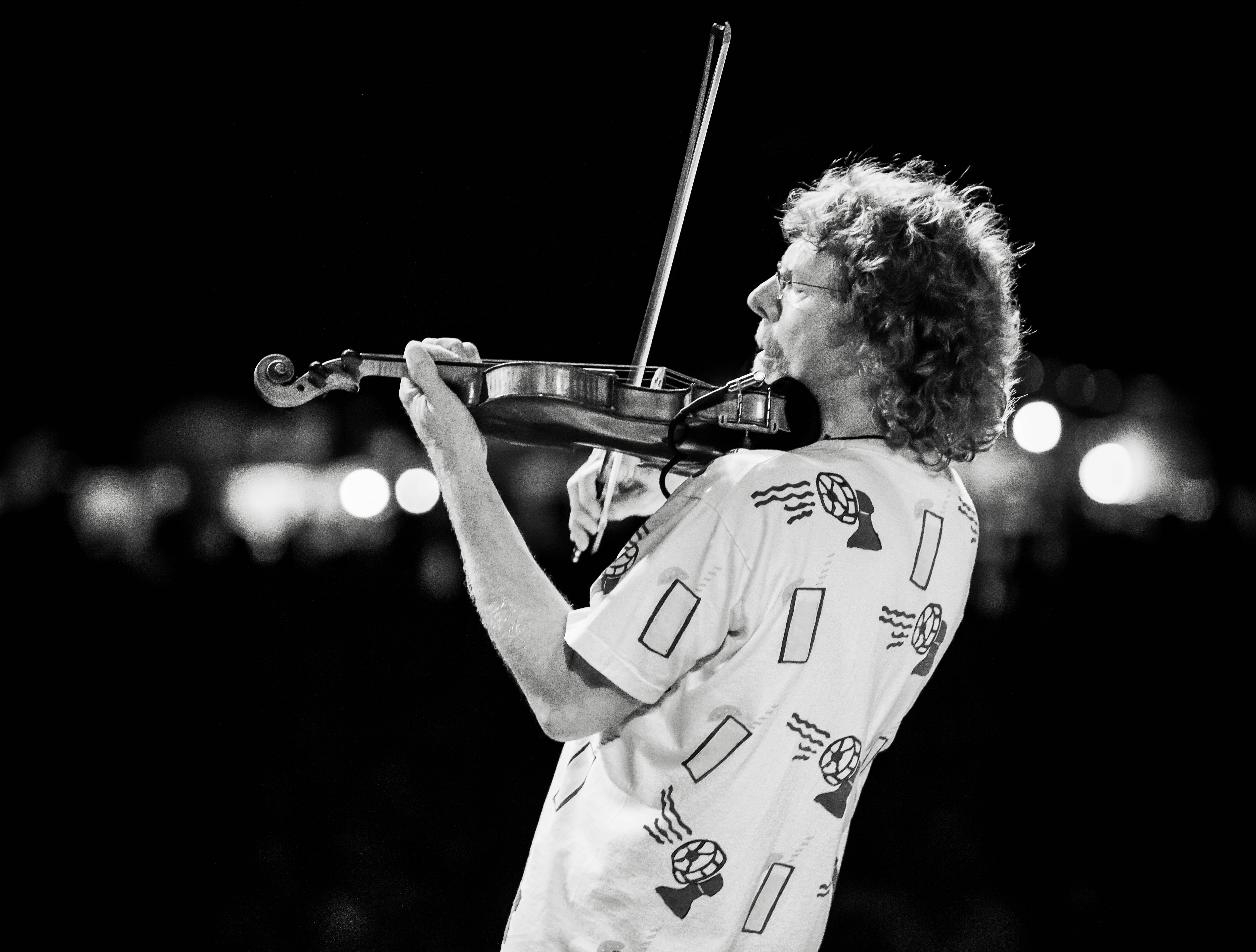 Sam Bush playing fiddle