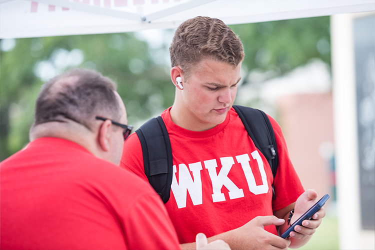 Individual looking at a smartphone