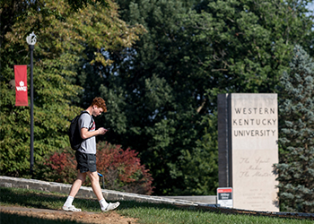 student walking near pylon