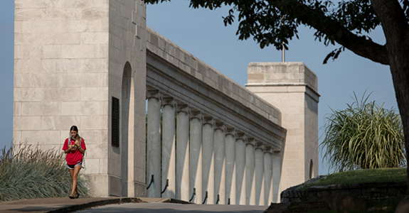 Student walking using phone