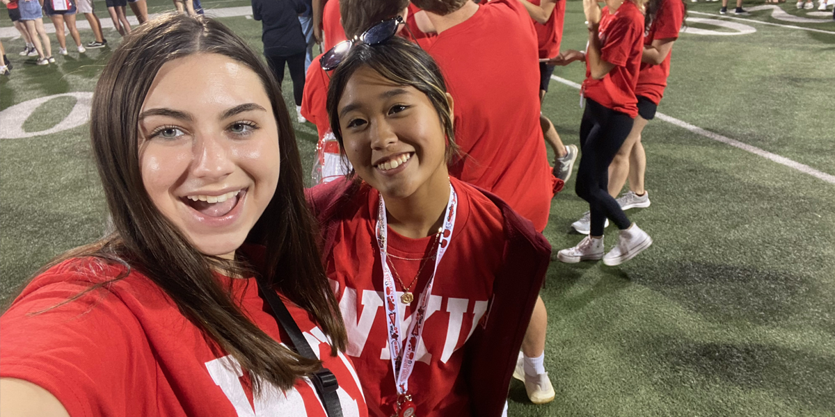 Two people smiling for a selfie at MASTER Plan