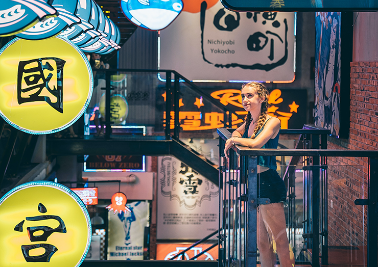 Woman in Japan looking at signs.