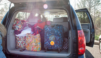 Open trunk stacked with luggage