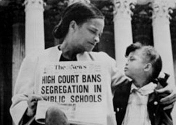 Two people with a newspaper