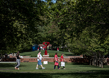 Parents Walking Across Centennial Mall