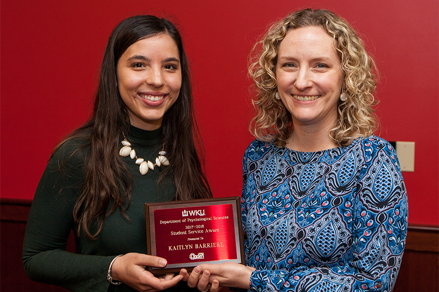 Student poses with Faculty member after winning award.