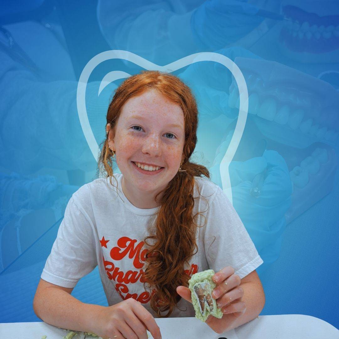 Student carving a tooth