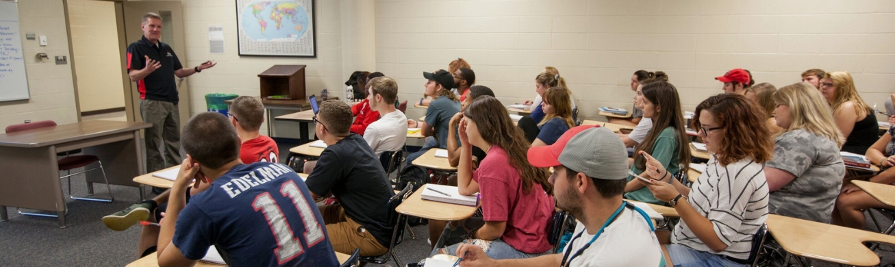 students sitting at desks in sociology class