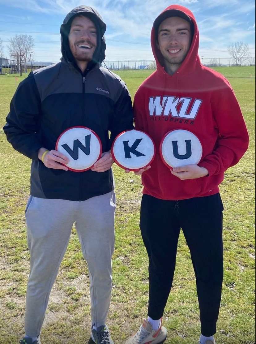 Students Holding Up WKU Signs