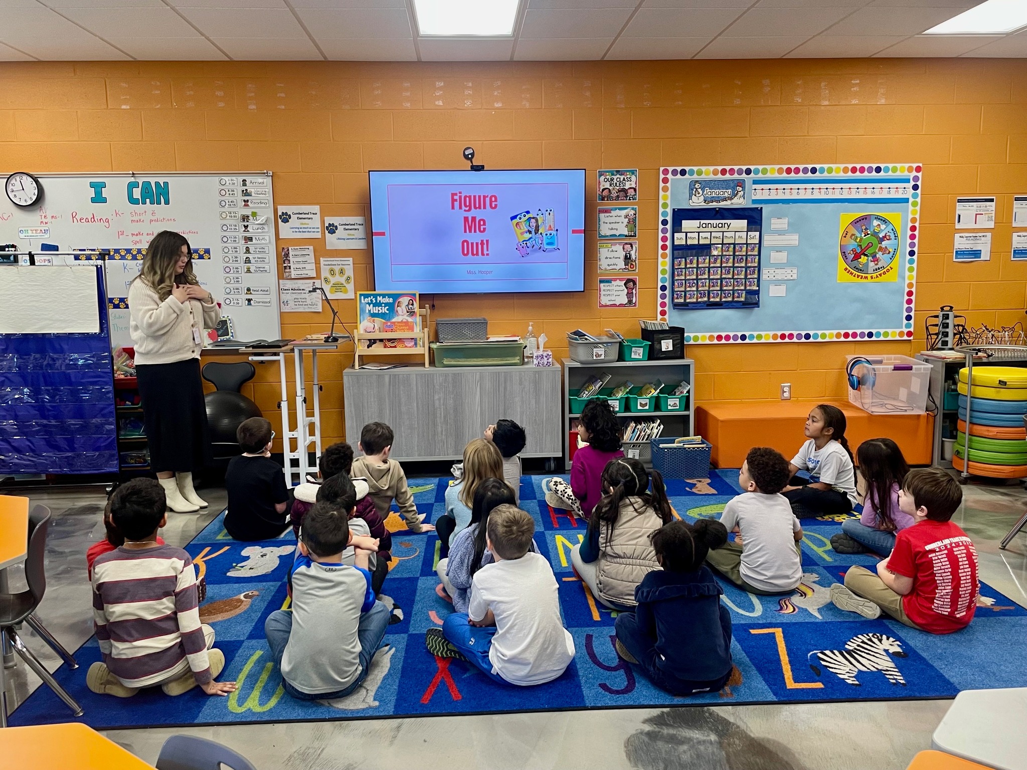 A student teacher leading a kindergarten classroom.