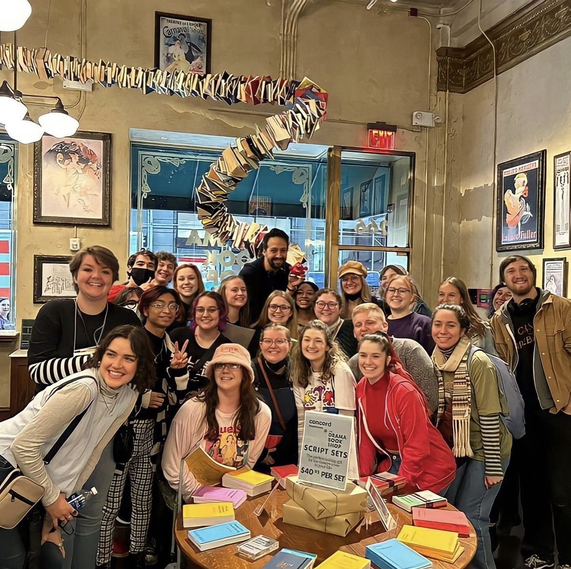 WKU Theatre and Dance students and professors standing around Lin Manuel Miranda, who is holding a mini squishie of Big Red.