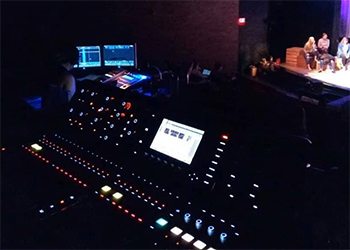 Theatre tech set-up in darkened theatre.