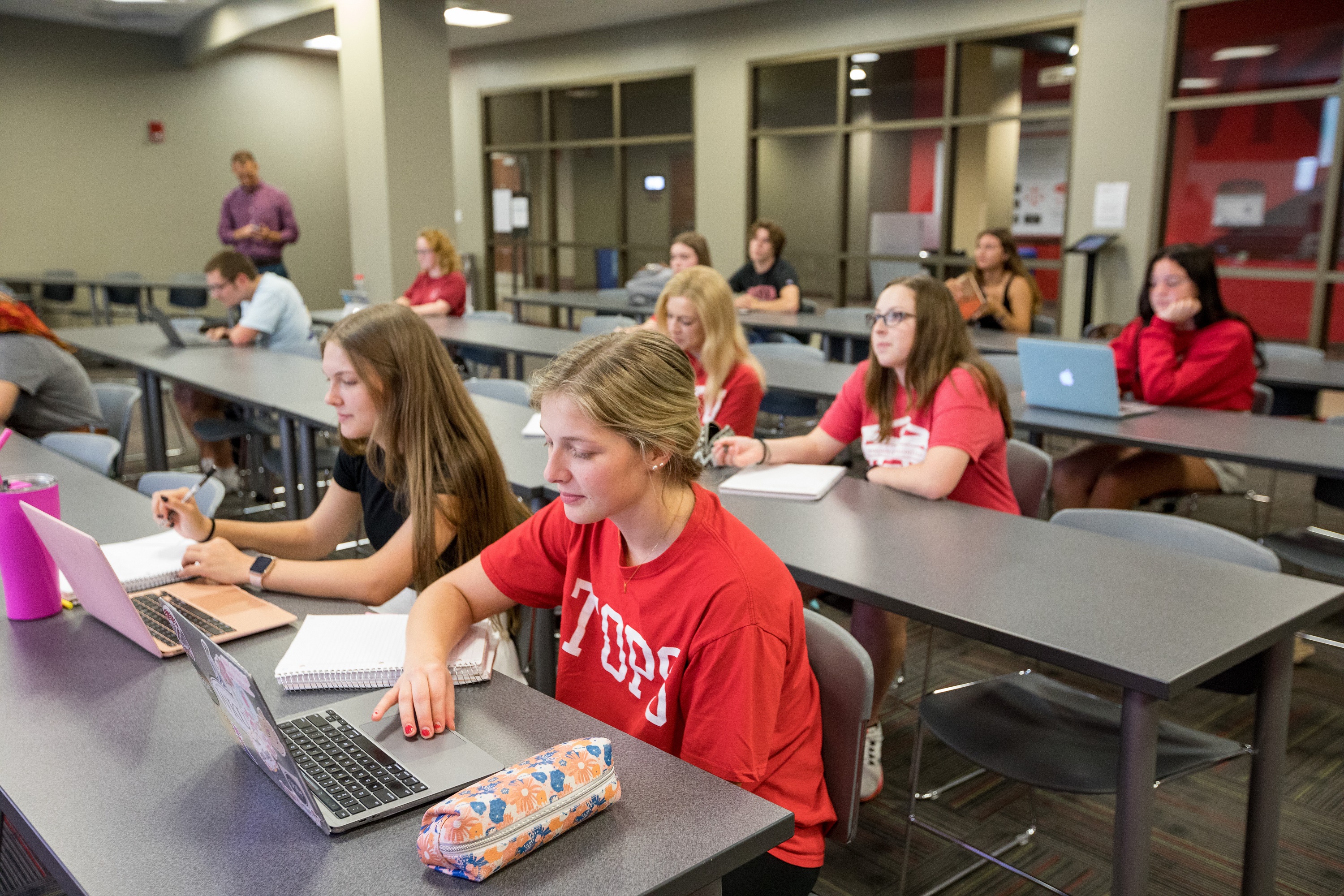 Group of students looking toward front of classroom