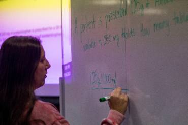 Person writing on a whiteboard