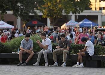 Friends enjoying food at Topper Fest
